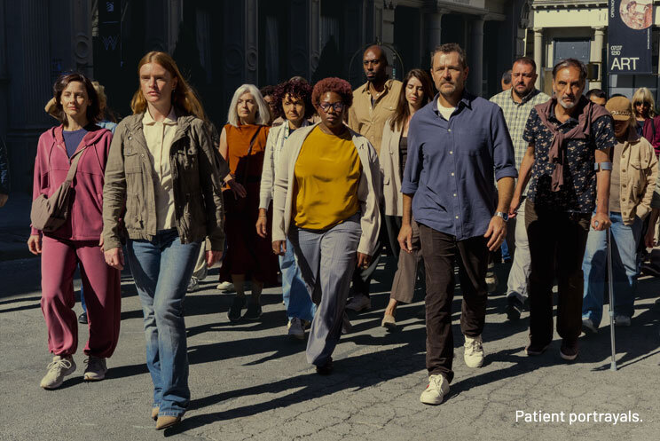 Diverse crowd crossing the street together in an empowered way